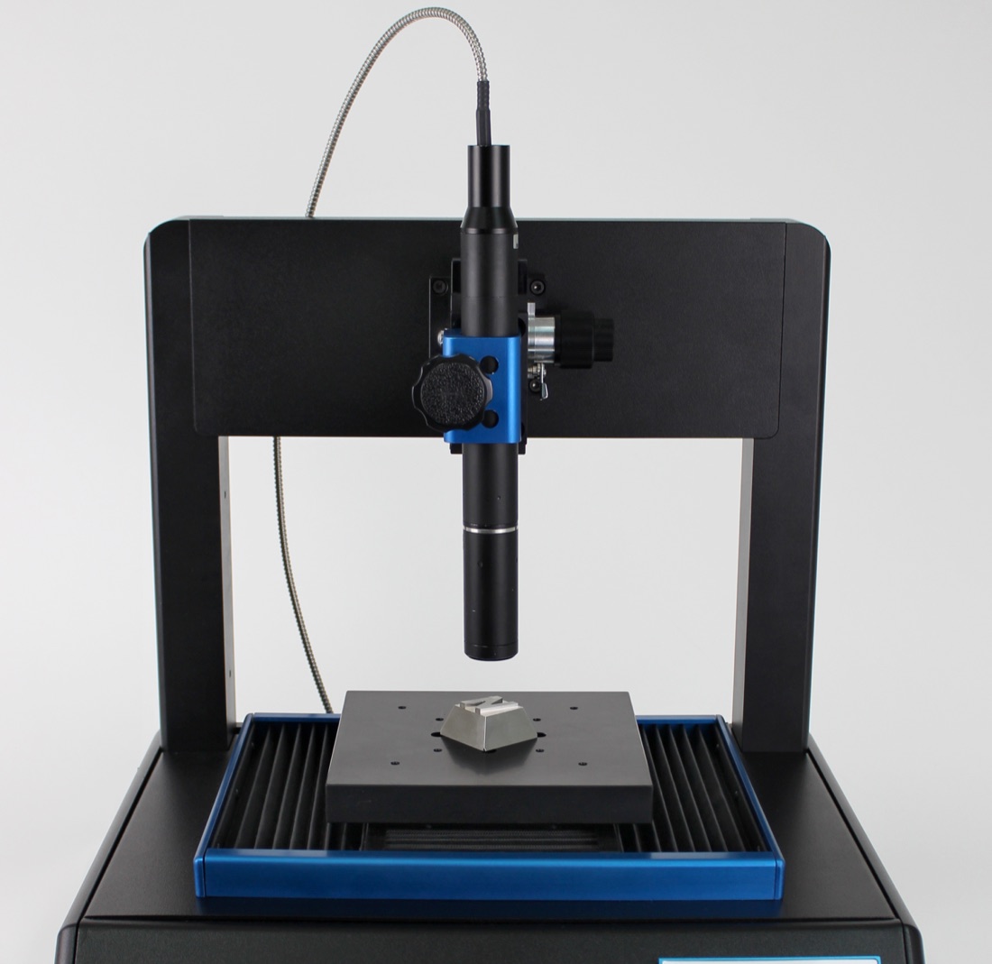 A non-contact optical profilometer with a sample beneath its measurement probe
